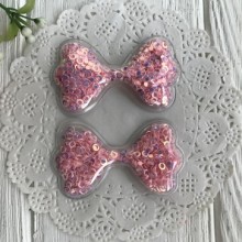 Силиконовый бантик з наполнителем, 6,3х3,6 см, розовые перламутровые колечки, упаковка 20 шт.