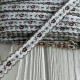 Жакардовая тесьма с волнистым краем, 1 см, светло-серая с шоколадным цветочком, рулон 20 м 